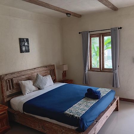 Adore Guesthouse Amed Zimmer foto