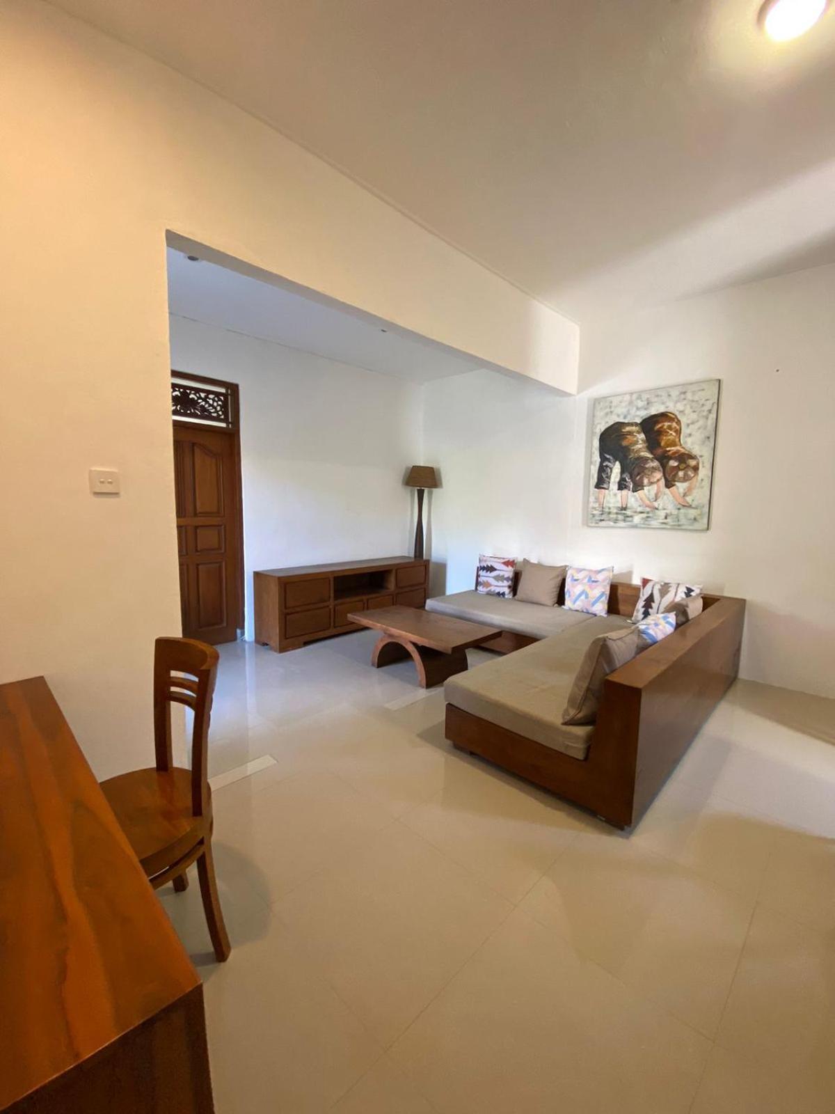 Adore Guesthouse Amed Zimmer foto